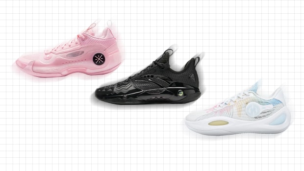 Side view of three multicolor basketball shoes.